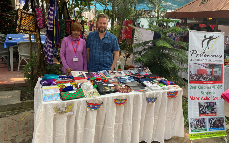 Patrick at the Maer Achol stall in the Dutch Club Charity Bazaar