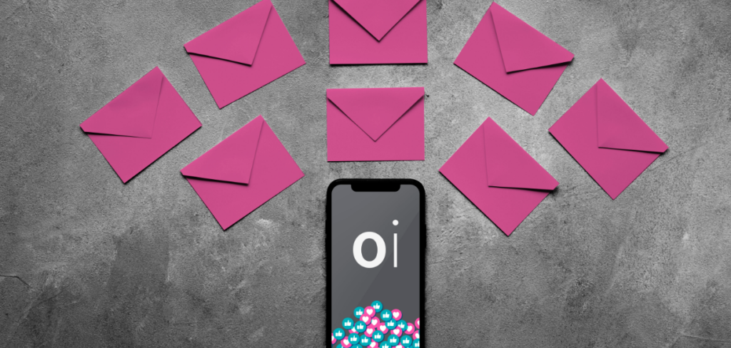 Selective color of pink envelopes surrounding a mobile with the OI logo