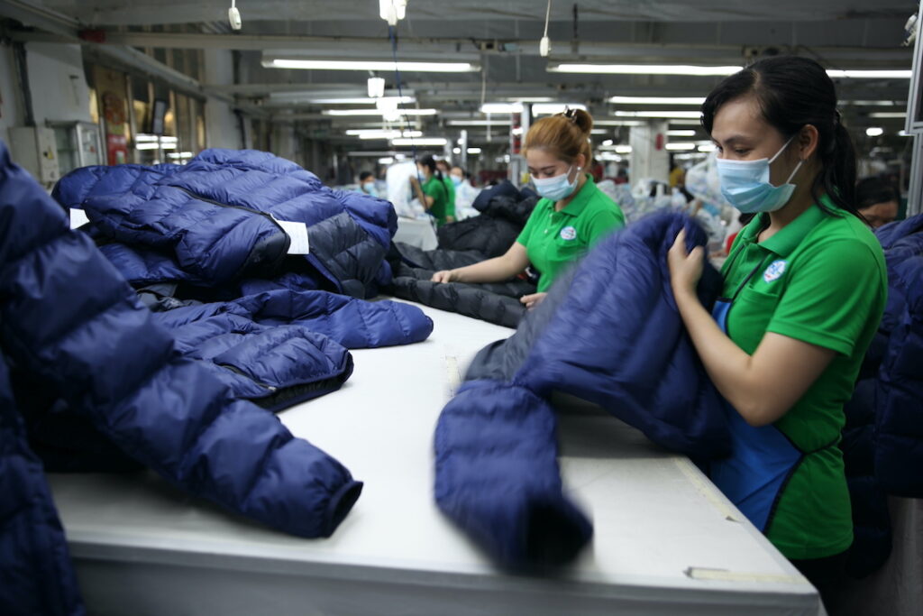 garment workers handling responsible down products